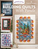 Building Quilts With Panels book cover with a mountain lake panel quilt and pieced border