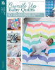 Bundle Up Baby Quilts book cover with a baby on a rainbow scalloped quilt