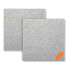 Two gray Oliso wool pressing MultiMats with orange connector points and a connector