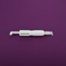 White plastic tool on a purple background