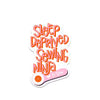 Sleep Deprived Sewing Ninja sticker with pink and orange lettering and a pink rotary cutter