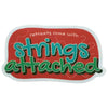 Retreats Come with Strings Attached sticker in teal and green lettering on red