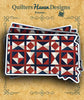 South Dakota state-shaped sticker with a red, white, and navy patriotic quilt pattern