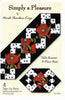 Simply a Pleasure pattern cover with red poppy table runner framed in black and polka dots