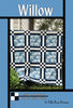 Willow quilt pattern cover with blue feature squares framed in navy stripes and nine patches
