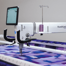 Handi Quilter Infinity 28 with Pro-Stitcher on Gallery 3 Lift Frame - Fabric Bash