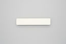 White magnetic piece on a white background