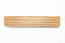 Oak stained magnetic piece on a white background